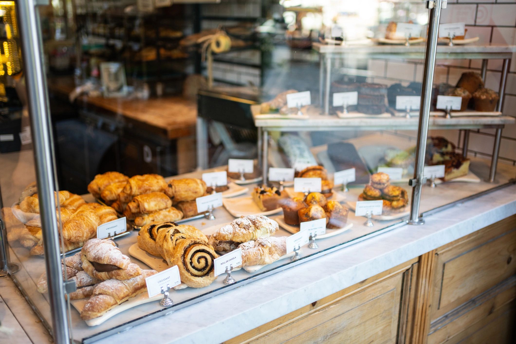 Fresh baked pastries displayed in a bakery case