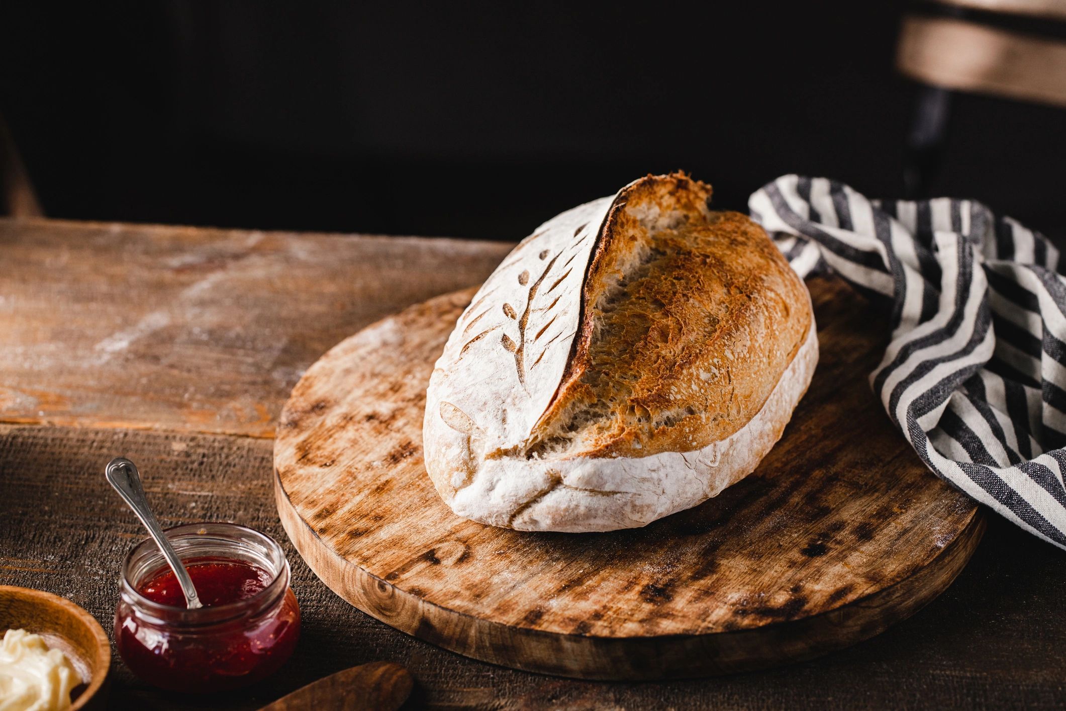 Loaf of sourdough bread on a wooden cutting board