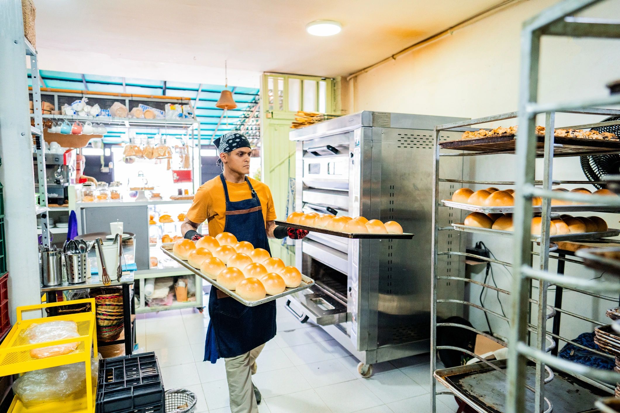 Baker preparing baked items in a kitchen