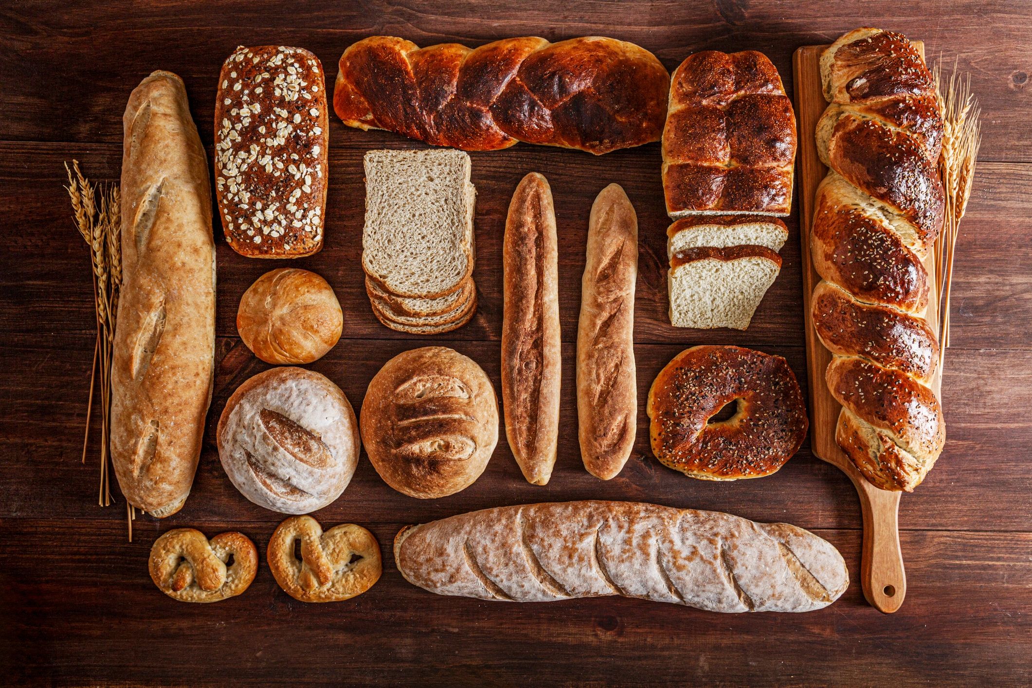 Assortment of artisan bread loaves on a rustic wooden table